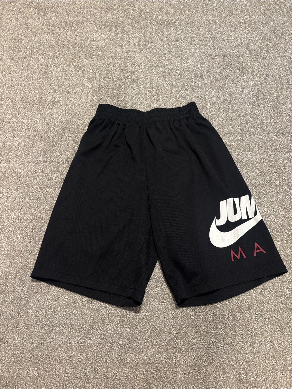 Nike Black Jumpman Logo Boys' Athletic Shorts with White Swoosh and Red Accents